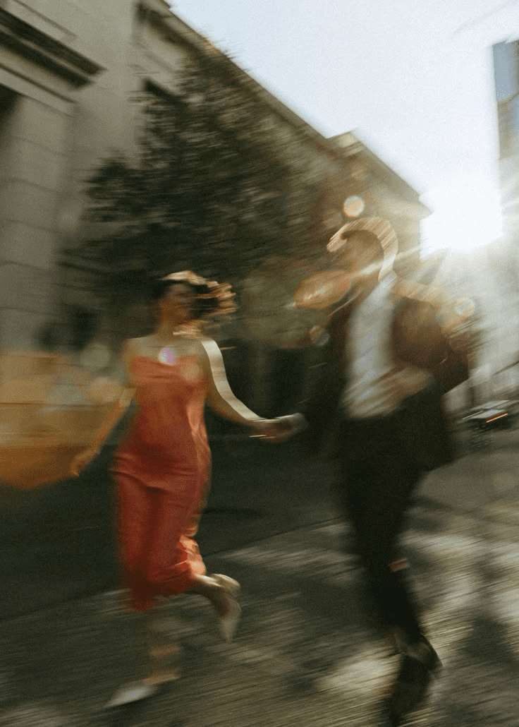 Blurred motion of people walking in warm city light